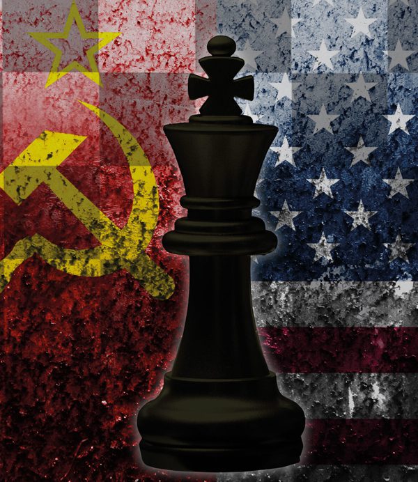 Chess piece, USSR and Us flags in the background.