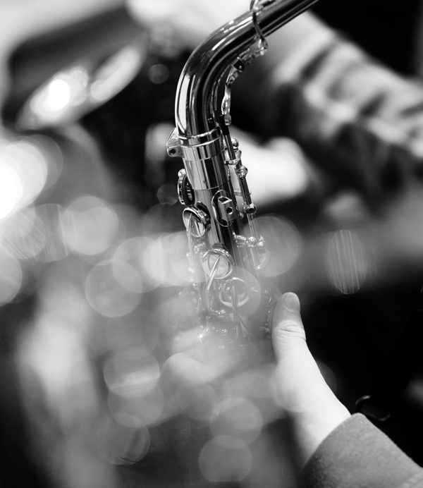 black and white photo of a saxophone being played