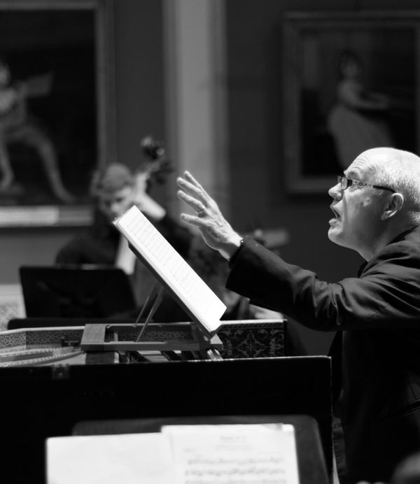 John Butt conducting in black and white