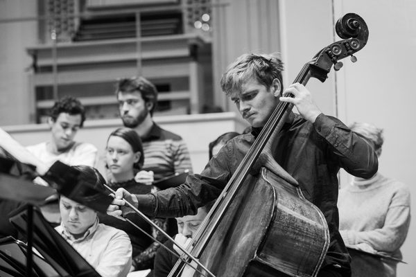 A double bassist in rehearsal