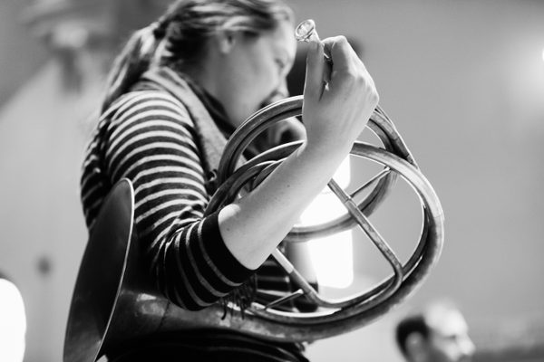 A natural horn being held.