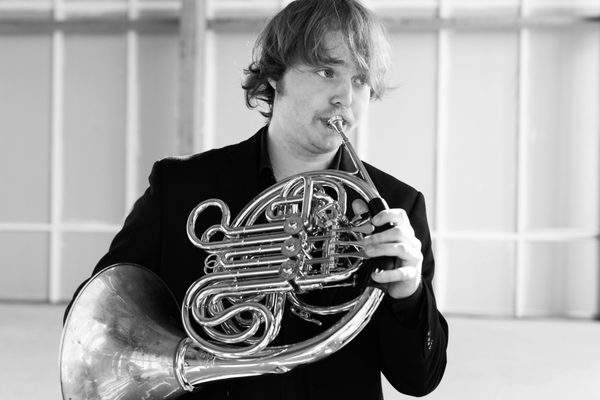 A horn player.