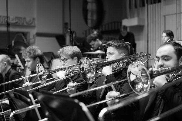 A trombone section in an orchestra.