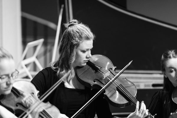 A viola player in rehearsal.