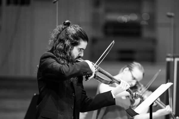 A violin player in rehearsal.