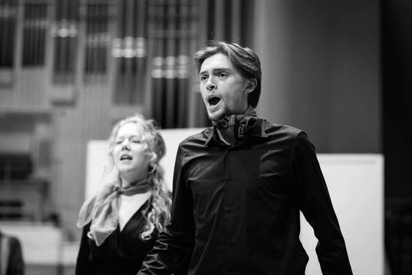 Two vocalists in performance.