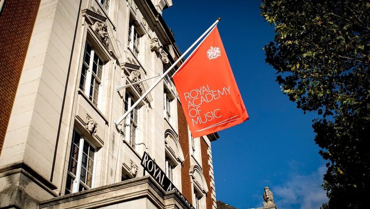 The facade of the Royal Academy of Music. A red Academy flag is being flown.