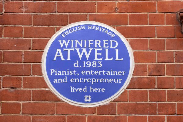 Winifred Atwell's blue plaque on a brick wall