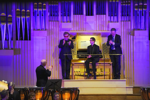 Elton John joins members of the academy staff on the Dukes Hall stage at the Royal Academy of Music