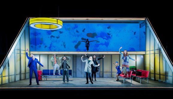 Staging of an opera with cast members pulling different striking poses