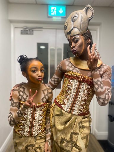 Mia-Nicole Alexander and Merryl Ansah pictured backstage in costume for The Lion King