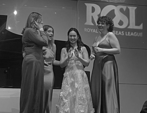 Caroline Blair, Charlotte Clapperton, Klara Solen, Binny Supin Yang stand on the ROSL stage in front of a piano