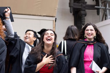 Graduates smiling and laughing