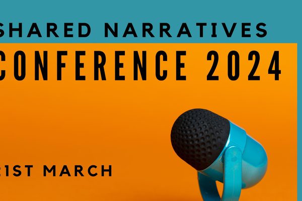 Decorative cover image for the "Shared Narratives" 2024 Conference containing a graphic of a microphone on black, orange and blue background.