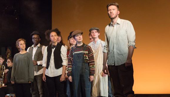 Performers on stage performing The Soldier's Tale