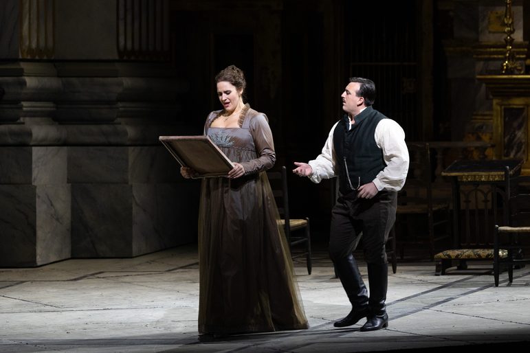 Two performers in a scene from Tosca