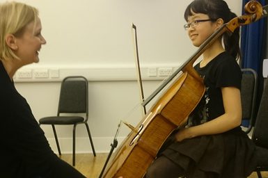 Cellist Mayuchi Ono receiving a lesson at Primary Academy