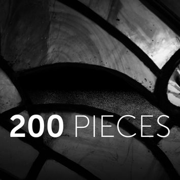 Closeup of stained glass in black and white with text '200 PIECES' overlaid.