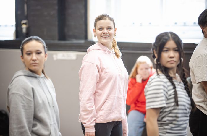 Young performers smile in class.