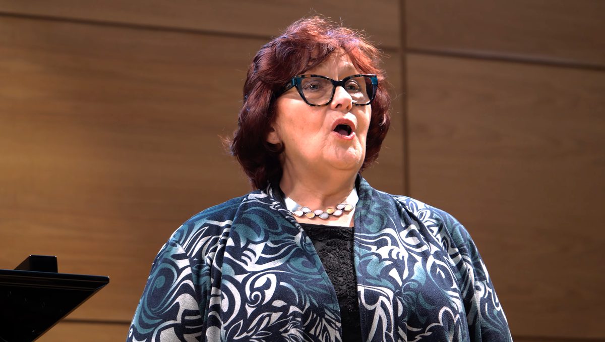 An opera singer mid-aria.