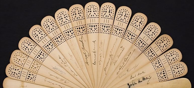 A collapsible fan containing signatures, from the McCann collection.