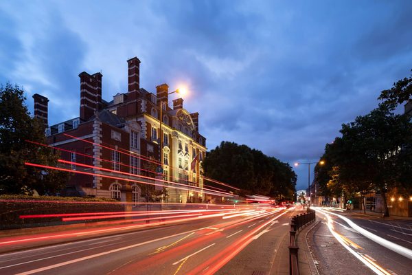 A long-exposure shot of traffic moving along Marylebone Road outside the Academy, at sunset.