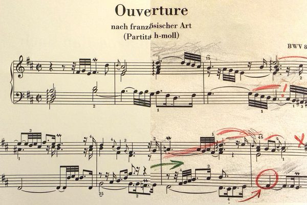 Close up on the first two lines of sheet music.