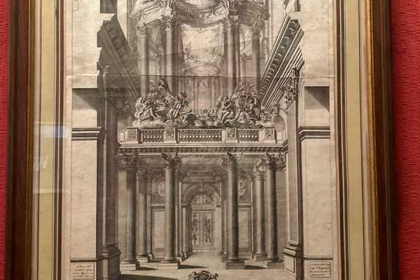 A framed lithographic image of an organ.