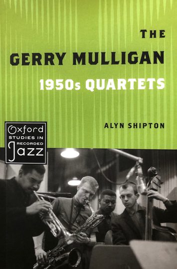 Book cover with title and black and white photo of 4 musicians playing.