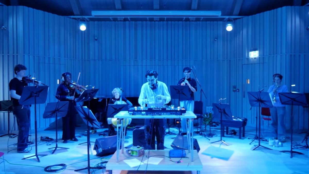 A classical ensemble accompanied by a DJ.