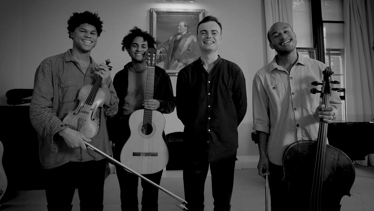 The Fantasia Orchestra smile to camera.