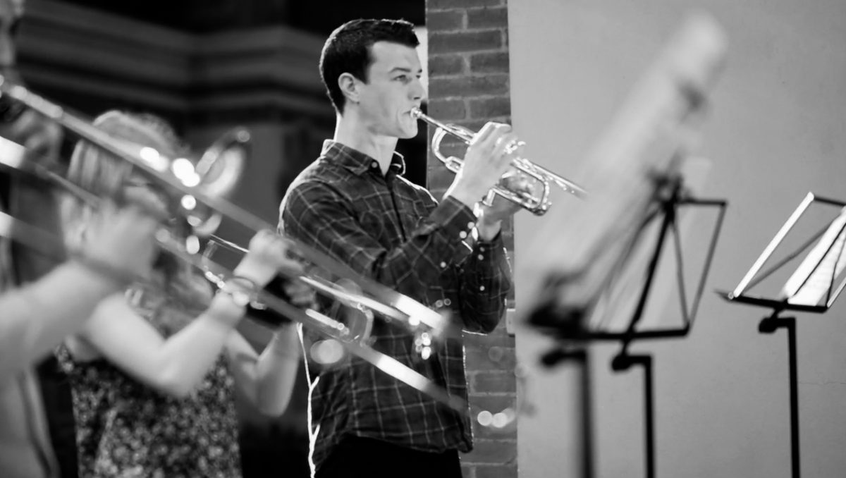 A trumpet player in rehearsal.