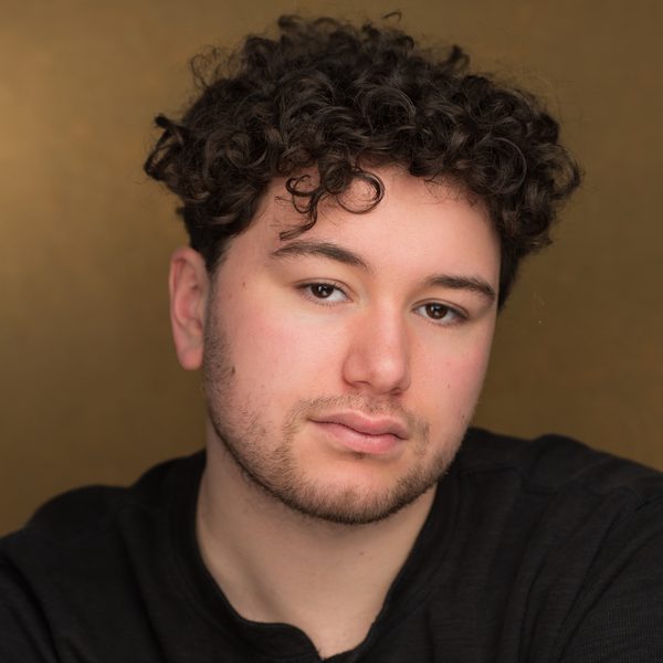 Portrait of Adam Haddour looking to camera.