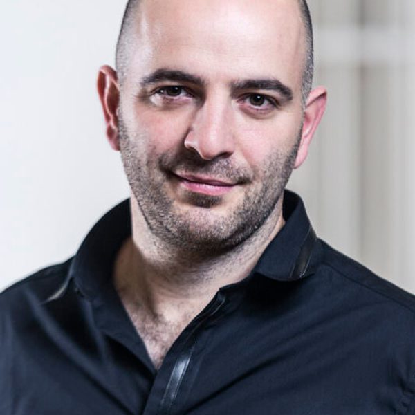 Portrait of Adrian Spillett looking to camera