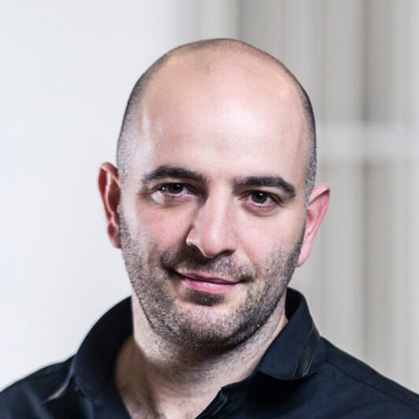 Portrait of Adrian Spillett looking to camera.