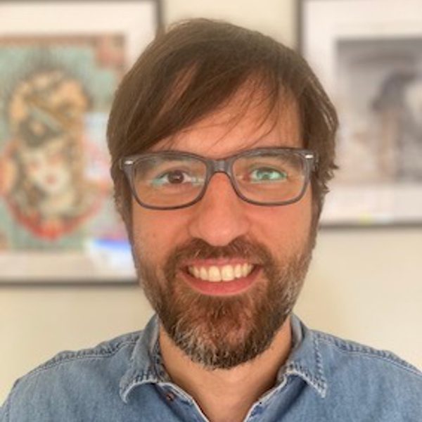 Alessandro Grottola smiles to camera.
