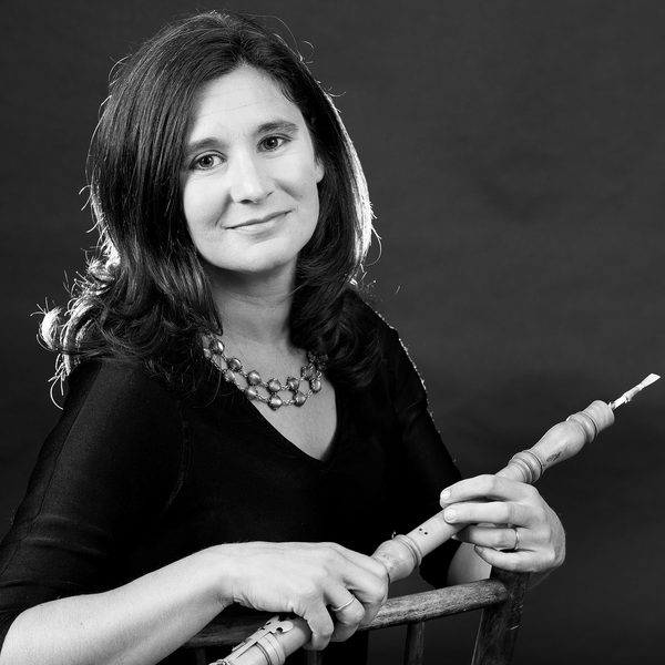 Alexandra Bellamy holding a baroque oboe.