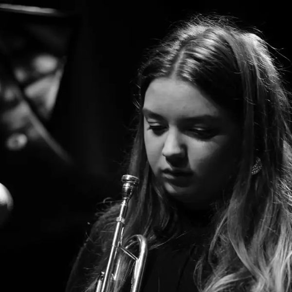 Alexandra Ridout holding a trumpet.