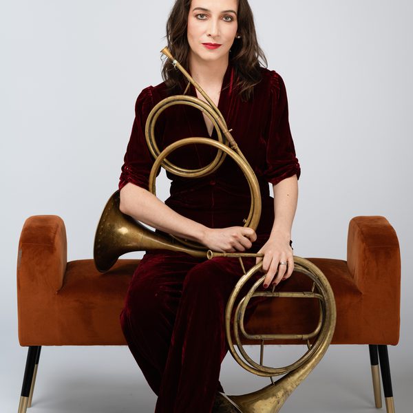 Anneke Scott holding a horn