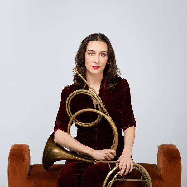 Anneke Scott holding two horns.