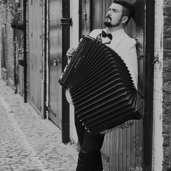 Bartosz Glowacki playing the accordion