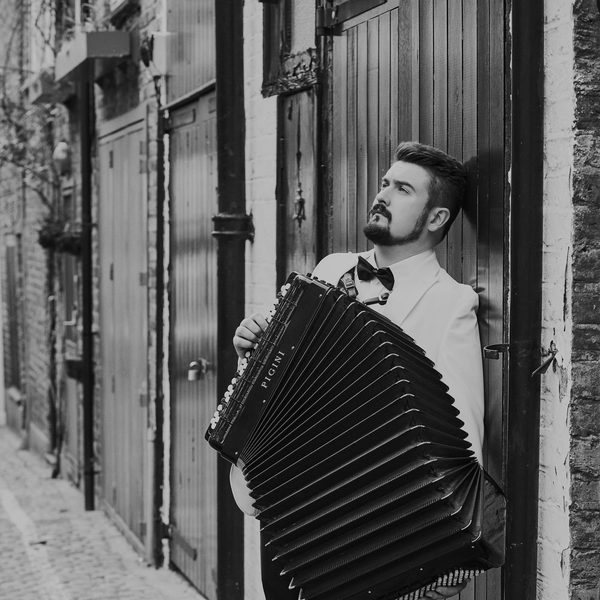 Bartosz Glowacki playing the accordion.
