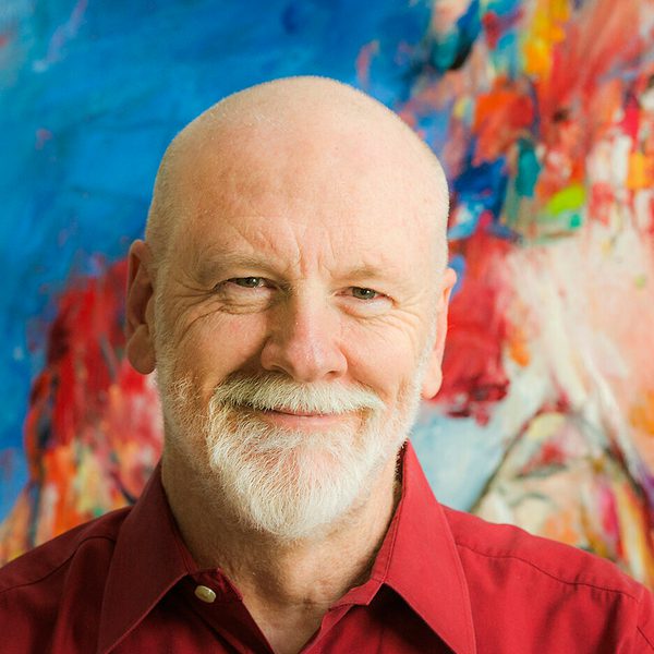 Portrait of Brett Dean smiling to camera.