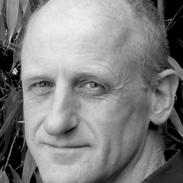 Headshot of Dr Christopher Atkinson, looking to camera.