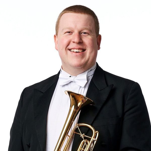 Picture of Christopher Hart holding a trumpet.