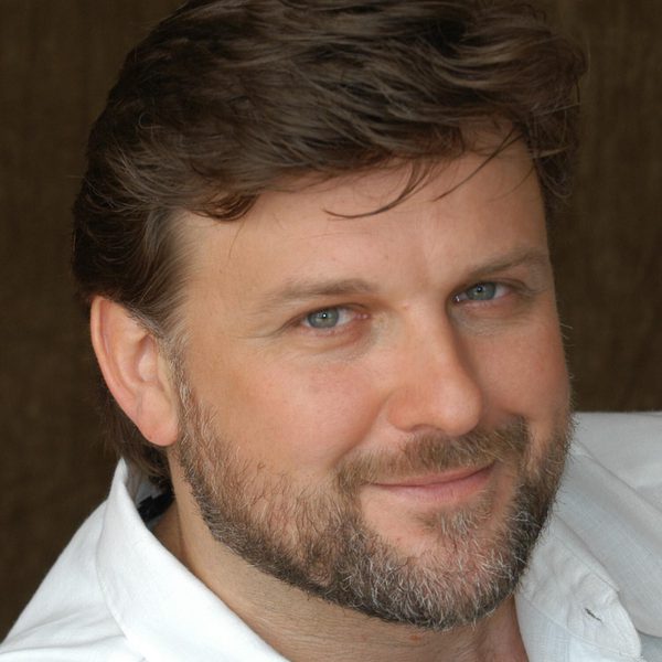 Christopher Ventris smiles to camera.