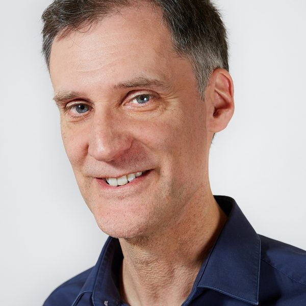 Portrait of Darius Battiwalla smiling to camera
