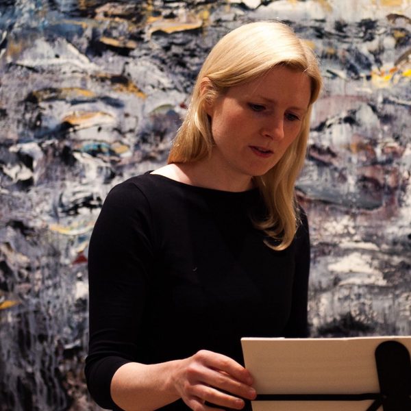 Composer Deborah Pritchard at a music stand.