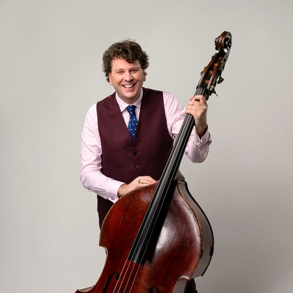 Dominic Seldis holds a cello.