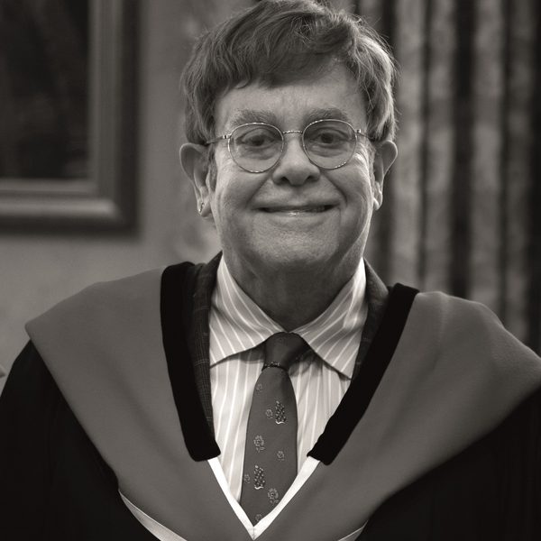 Elton John Smiles for camera